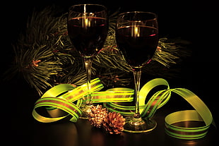 two clear long-stem wine glasses