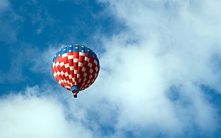 red and white hot air balloon during day time HD wallpaper