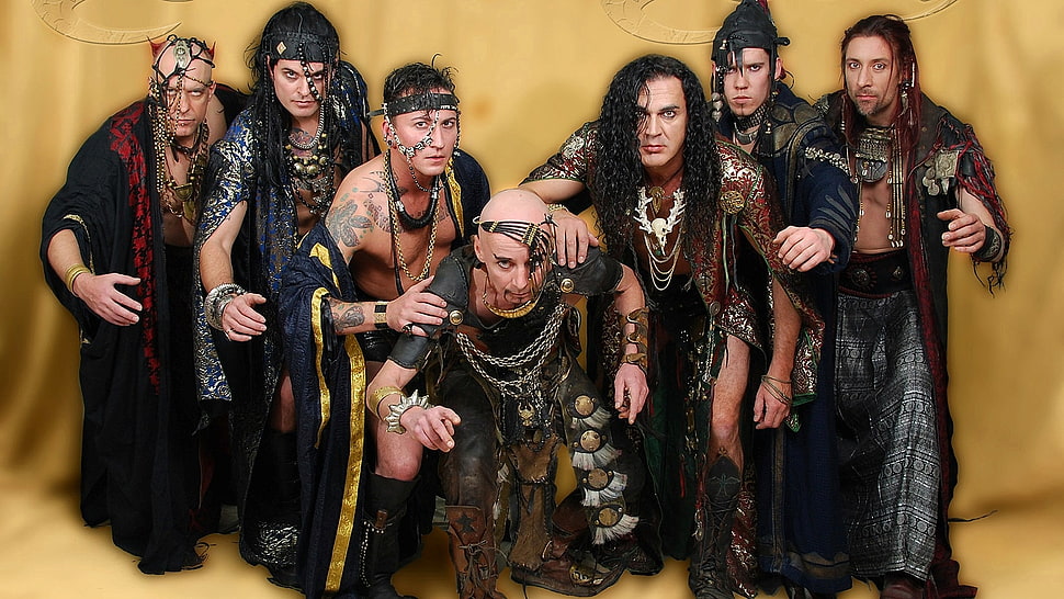 seven men in traditional dresses HD wallpaper