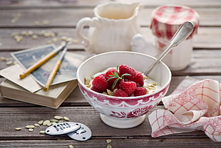 white and red bowl with raspberry