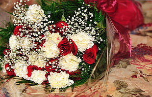 red artificial Rose flowers and white Chrysanthemum flowers bouquet