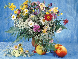 assorted petaled flower bouquet with vase