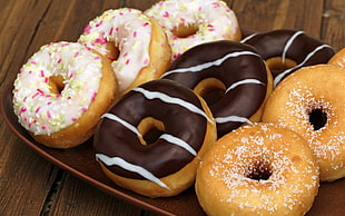 variety flavored doughnuts on plate