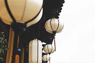 three white ceiling lanterns photo taken during daytime