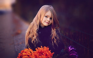 girl in black trench  coat holding orange and purple flowers HD wallpaper