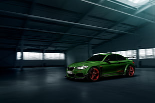 green coupe parked inside the building HD wallpaper