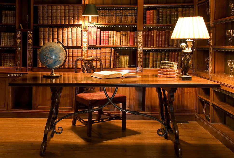 gamma photography of brown wooden table with desk globe inside library HD wallpaper