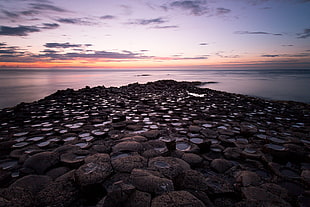 white and red floral mattress, Ireland, Giant's Causeway, sunset, sea