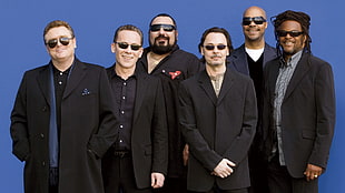 six men wearing black sport sunglasses