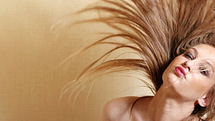 photo of woman flip her hair
