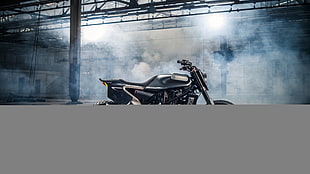 black standard motorcycle parked on concrete road near wall HD wallpaper