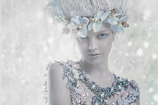 photo of goddess wearing white flower headband