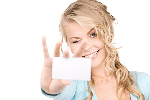 woman holding white card with white background HD wallpaper
