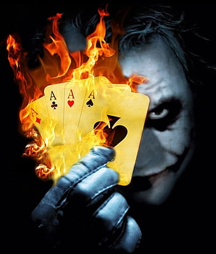 joker holding four flaming ace playing cards illustration HD wallpaper