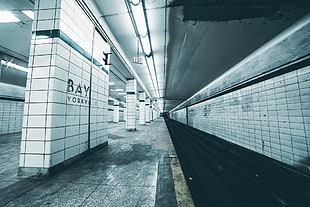 white and black metal frame, subway, train station