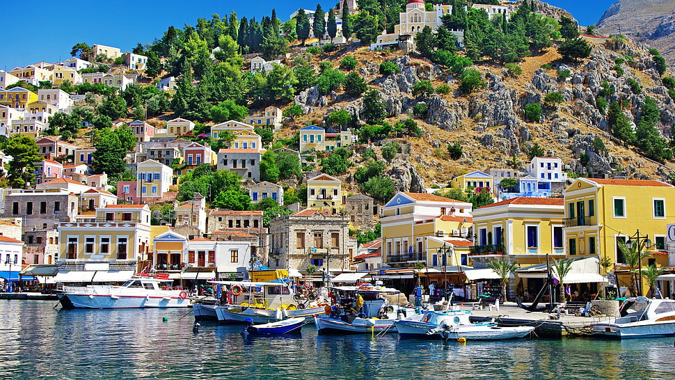 white and yellow concrete houses, city, Greece, Symi, boat HD wallpaper