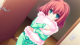 girl with red hair and wearing green pajama set holding pillow standing near opened door