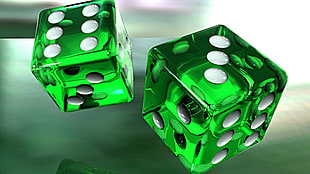two green glass dices