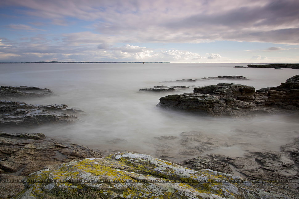 white fog on stone fragments during daytime HD wallpaper