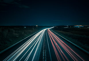 timelapse photography of road during night time