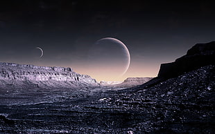 mountains overlooking two planets