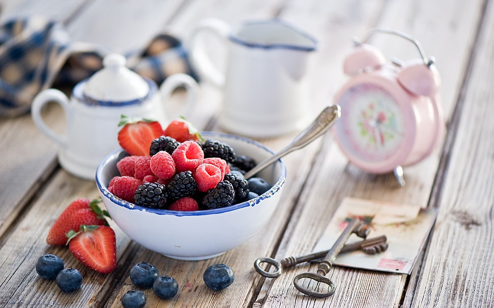 Strawberries and Blueberries on white ceramic bowl HD wallpaper
