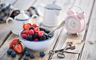 Strawberries and Blueberries on white ceramic bowl