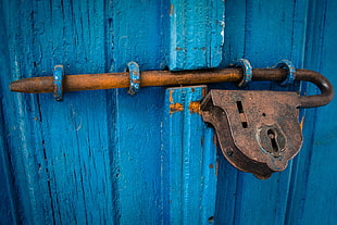 showing vintage padlock on door lock