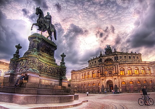 man riding horse statue beside palace, dresden