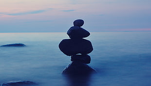 four rocks balancing photo