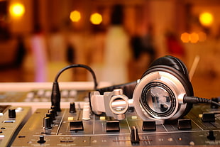 gray and black headphones and black audio mixer, headphones