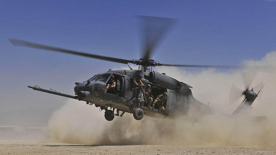 helicopter with soldiers preparing to take off during daytime HD wallpaper