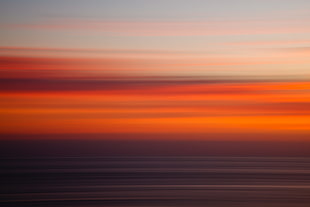 red and black tanning bed, beach, sunset, abstract, panning