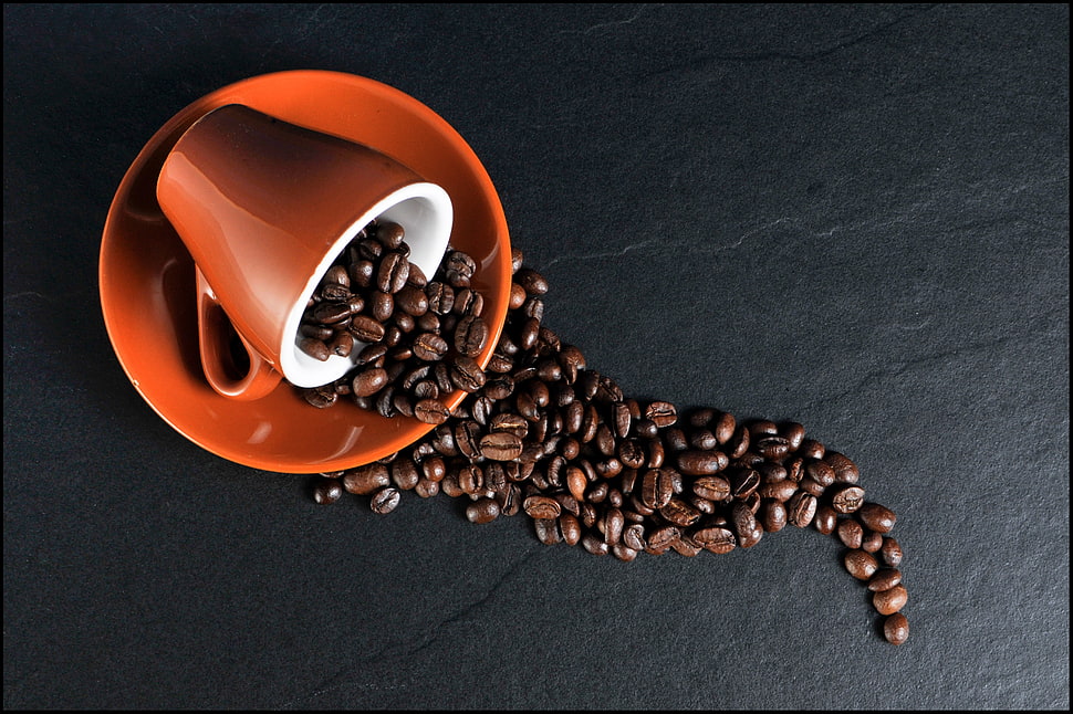 spilled coffee beans on mug HD wallpaper