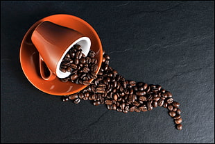 spilled coffee beans on mug HD wallpaper