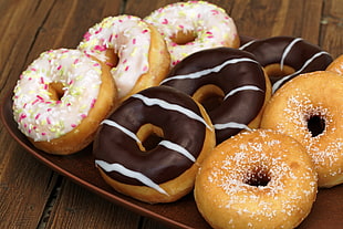 photo of nine assorted flavored of doughnuts