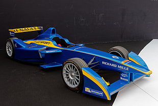 blue and yellow Renault Richard Mille formula 1 car on black surface