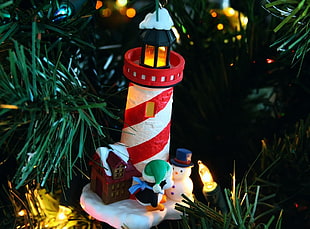 red and white lighthouse and snowman ornament