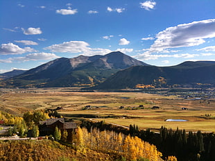 landscape photography of hill under white clouds and blue sky, crested butte, usa HD wallpaper