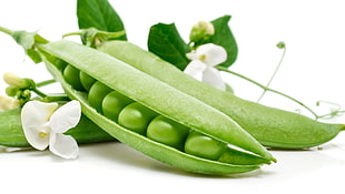 selective focus photography of green peas