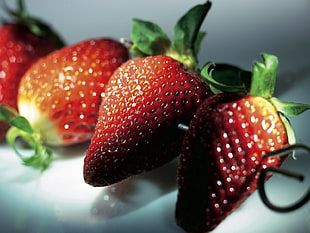 four red strawberries