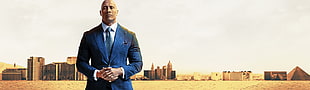 Dwayne Johnson in blue suit digital wallpaper
