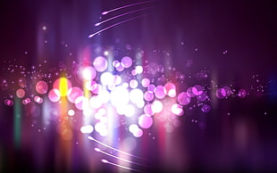 boke light photography of purple and orange light
