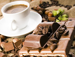chocolate bar near cup of coffee