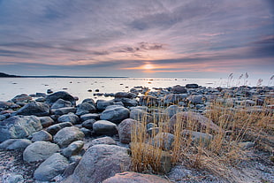 landscape photography of boulder rocks beside sea HD wallpaper