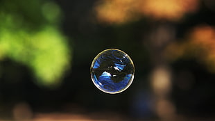 round silver-colored coin, bubbles