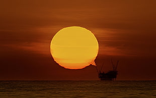 silhouette flagship, sunset, oil rig