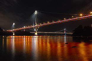 lights on bridge during nighttime