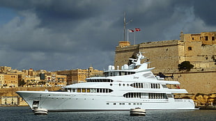 white cruise ship, yacht, flag, cityscape, vehicle