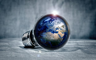 edited photo of earth on light bulb HD wallpaper